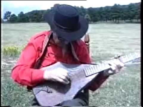 JIMMY DRIFTWOOD playing on his famous homemade guitar